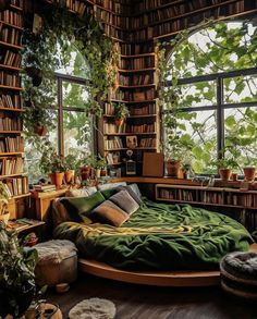 a bedroom with bookshelves and plants in the window, along with a circular bed