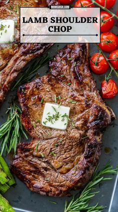 two steaks and asparagus on a plate with tomatoes