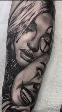 a woman's arm with tattoos on it