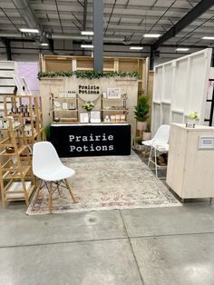 a room filled with lots of chairs and tables next to walls that have plants on them