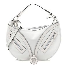 This is an authenticVERSACE Calfskin Medium Repeat Zip Hobo Optical in White. This luxurious shoulder bag is crafted of Versace calfskin leather in white. The bag features a looping top handle, an optional shoulder strap, a silver medusa zipper on the front with two zipper pockets on either side. The double top zippers open to a matching black fabric interior with zipper pocket. Bowling Bags, Top Handle Handbags, Crystal Chain, Black Backpack, White Bag, Bag Straps, Pink Bag, Black Fabric, Belt Bag