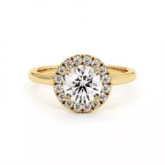 a yellow gold engagement ring with a round diamond center