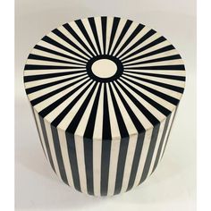 a black and white striped box with a circular design