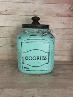 a blue cookie jar sitting on top of a wooden table