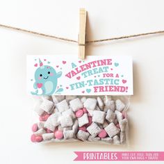 a bag of marshmallows on a clothes line with a valentine's treat sign