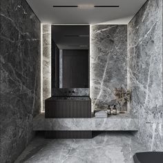 a bathroom with marble walls and flooring