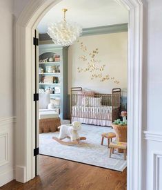 a baby's room with a crib and rocking horse