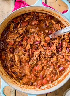 a large pot filled with chili and beans