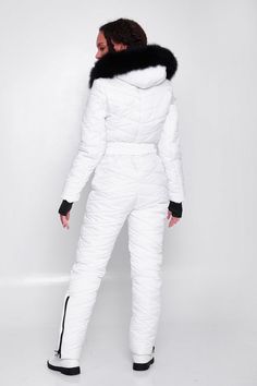 White ski suit for women is made of quality waterproof fabric and modern filler that does not cause allergies and is able to stay warm even at temperatures of -13°F (-20-25°C).The design and cut of the ski jumpsuit are thought out to the smallest detail. You will love the zippered pockets and the strap that fits well to the body for a feminine silhouette.You will also be delighted with the large fur hood. The fur and hood are removable. On the sleeves of the snowsuit there are knitted cuffs with White Snow Suit, White Long Sleeve Winter Jumpsuits And Rompers, White Fitted Winter Jumpsuit, White Fitted Jumpsuits And Rompers For Winter, Fitted White Jumpsuits And Rompers For Winter, White Long Sleeve Jumpsuits For Winter, Fitted Ski Outerwear For Ski Season, Fitted Outerwear For Ski Season, Winter Outdoor Long Sleeve Jumpsuits And Rompers