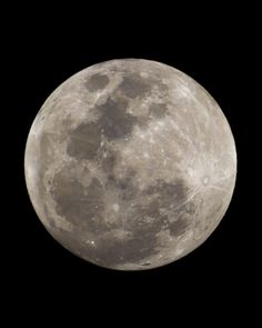 the full moon is seen in the dark sky