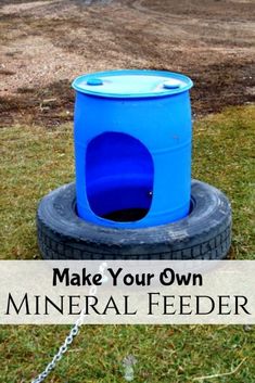 a blue barrel sitting on top of a tire with the words make your own mineral feeder