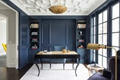 an office with blue walls and white carpeting is featured in the cover of houzz magazine