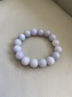 🌈 13.5mm Jadeite Beaded Bracelet, Light Lavender & Green 🌷 Untreated Natural Jadeite/ Grade A Jade 🌷 Certified : YES 🌷 Jade from Myanmar/ Burma 🌷 Bead size : 13.5 mm 🌷 Color : Light Lavender & Light Green 🌷 Free shipping from Hong Kong by with tracking number provided 🌷 Take approximately 7-28 days to arrive worldwide Lavender 8mm Beads Jewelry For Healing, Elegant Lavender Crystal Bracelet With Round Beads, Classic Purple Round Bead Jewelry, Lavender Round Bracelet For Healing, Elegant Hand-strung Round Bead Gemstones, Elegant Lavender Beaded Bracelets With Gemstone, Elegant Lavender Gemstone Beaded Bracelets, Elegant Lavender Beaded Bracelet For Healing, Elegant Lavender Jewelry With Round Beads