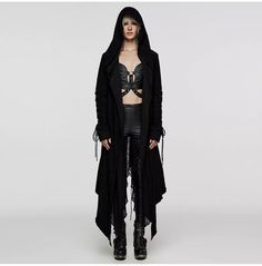 Elevate your gothic wardrobe with our Gothic Black Hooded Long Coat with Rivet Accents, a stunning blend of elegance and edginess designed to make a bold statement. Perfect for those who appreciate dark, captivating fashion, this coat offers both style and functionality.  Key Features:  - Premium Fabric: Crafted from high-quality, ripped knitted fabric and elastic textured striped fabric, ensuring durability and comfort. - Double-Layered Hood: The unique hooded design features a draping matching fabric that combines rigidity with softness, perfectly enhancing your silhouette. - Rivet Accents: Eye-catching rivet detailing on the sleeves and pockets adds a rebellious touch, making this coat stand out. - Adjustable Features: The coat includes adjustable cotton cords on the sleeves and a rear Gothic Trench Coat, Goth Plus Size, Punk Hoodie, Pagan Fashion, Gothic Blouse, Plus Size Gothic, Sleeve Stitching, Gothic Coat, Gothic Jackets