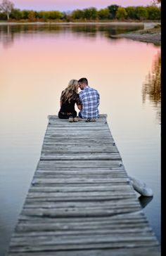 two people sitting on a dock with the words easy written in front of them,