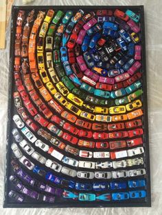 a multicolored car mosaic is displayed on the wall