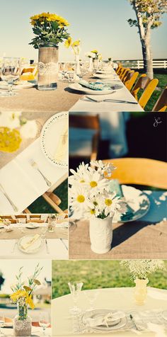 the table is set with flowers in vases, plates and napkins on it