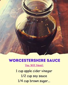 a jar filled with liquid sitting on top of a wooden table