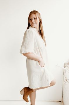 Be airy, fairy light with our Cream colored Puffed Sleeved Light Linen Dress. Perfect for all spring and summer occasions, as well as Easter! The elasticized puffer sleeves can be styled up or down, while the button front adds a touch of charm. Complete your look with cowgirl boots or sandals. Spring Daywear Relaxed Fit Puff Sleeve Dress, Spring Relaxed Fit Puff Sleeve Dress For Daywear, Spring Puff Sleeve Relaxed Fit Dress For Daywear, Spring Daywear Puff Sleeve Dress With Relaxed Fit, Casual Puff Sleeve Dress For Spring, Casual Puff Sleeve Dress With Balloon Sleeves For Spring, Casual Puff Sleeve Dress With Balloon Sleeves For Daywear, Casual Summer Puff Sleeve Dress With Gathered Sleeves, Billowy Puff Sleeve Dress For Summer Days