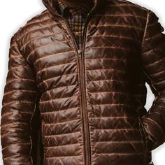 Rugged style meets winter warmth in our Men's Brown Leather Puffer Jacket. Crafted from supple, genuine leather with a rich brown hue, this jacket features quilted puffer insulation for superior heat retention. The classic silhouette is enhanced with a stand-up collar, zippered front, and snug cuffs to keep the cold at bay. Practical side pockets provide storage and hand-warming comfort. Perfect for the fashion-conscious man who doesn't compromise on functionality, this jacket seamlessly transitions from outdoor adventures to city streets. Key features: Premium brown sheepskin leather exterior for durability and style Quilted puffer design for superior insulation Adjustable hem to seal out cold air Multiple pockets for convenient storage Satin lining for a luxurious feel Premium YKK zipper Biker Shirts Women, Spiked Leather Jacket, Mens Leather Blazer, Motorcycle Leather Vest, Racer Jackets, Thigh Bag, Western Bag, Varsity Jacket Women, Leather Puffer Jacket