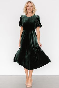 The perfect dress for date night or other special occasions Hunter green color Velvet material with some stretch Round neckline with keyhole and button at back Elastic waist line Short puff sleeves with elastic cuffs A-line midi length skirt Lined in sleeves and bodice - skirt is not lined Self: 95% Polyester, 5% Spandex Lining: 100% Polyester Trina is 5'6, cup size 32D, size 2 and is wearing size S Cocktail Jumpsuit, Destination Dress, Green Velvet Dress, Velvet Midi Dress, Romper Outfit, Midi Length Skirts, Velvet Fashion, Holiday Dress, Christmas Dress