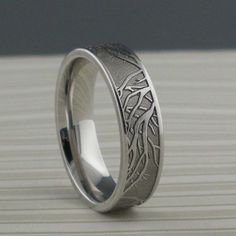 a wedding ring with an intricate design on it