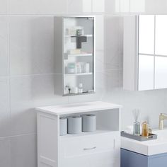 a bathroom with a sink, mirror and medicine cabinet