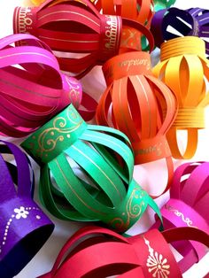 an instagram page with many different colored paper lanterns in the shape of balls and ribbons