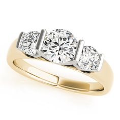 three stone diamond ring in yellow gold with diamonds on the sides and four prongs