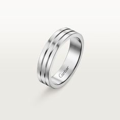 a white gold wedding ring with three stripes