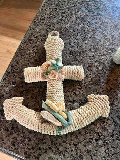 a cross made out of rope on top of a counter