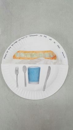 a paper plate with a hot dog on it and fork, knife, and spoon