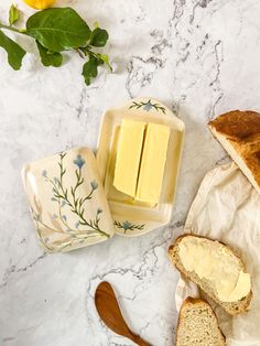 sliced bread and butter on a marble counter top