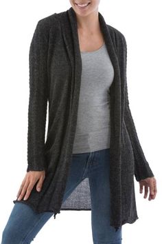 Paola Cuentas designs a feminine long cardigan in sleek dark gray. Knitted of genuine 100% alpaca the cardigan features patterned textures on the sleeves to contrast with the solid body. The ample front subtly rolls inwards to remain open. Alpaca Cardigan For Fall, Long Sleeve Alpaca Cardigan For Fall, Gray Cable Knit Cardigan For Layering, Charcoal Long Sleeve Sweater, Alpaca Cardigan, Cardigan Winter, Alpaca Sweater, Knit Alpaca, Wool Clothing