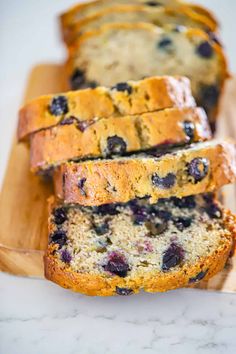 slices of blueberry bread on a cutting board