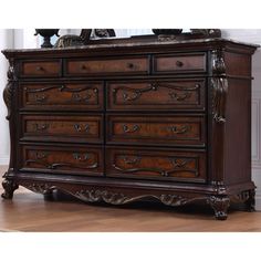 an ornate dresser with many drawers in it