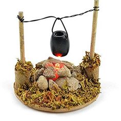 a small fire pit with rocks and lights