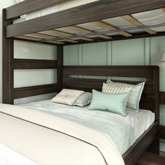 there is a bed with a wooden frame and white sheets on the bottom bunkbed