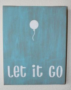 a painting with the words let it go written in white on a teal background