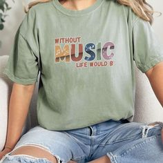 Check out our store for more designs! https://www.etsy.com/shop/InspiredbymomSC This Music Lover T-Shirt is the ultimate statement piece for anyone with music in their soul! Whether you're a dedicated music teacher, proud band mom, or passionate band member, this tee captures the rhythm of your life. Designed with comfort and style in mind, it's perfect for casual days at school, marching band practice, or nights spent enjoying live music. Looking for the ideal Gift for Your Marching Band Studen Cheap Music-themed Fan Merchandise Shirt, Band Practice, Band Mom, Music Life, Top Band, Music Teacher, Marching Band, Music Lover, Music Is Life