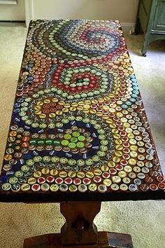 a table made out of bottle caps on top of a carpeted floor in front of a door