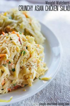 a white plate topped with pasta and vegetables