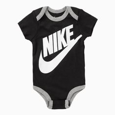 Introduce your little one to the iconic style of Nike with the Kid's Futura Bodysuit 3-Piece Box Outfit. Made with soft and comfortable material, this outfit features a bodysuit, hat, and booties, perfect for keeping your baby cozy and stylish. The classic Nike logo adds a touch of athletic flair to this versatile set. More Details Color: Black Style: MN0073-023 Fitted Casual Bodysuit For Playwear, Black Cotton Onesie For Summer, Black Short Sleeve Bodysuit For Spring, Casual Black Short Sleeve Bodysuit For Spring, Black Short Sleeve Casual Bodysuit For Spring, Black Summer Onesie For Playtime, Black Cotton Onesie With Letter Print, Black Playful Bodysuit For Casual Wear, Playful Fitted Black Bodysuit