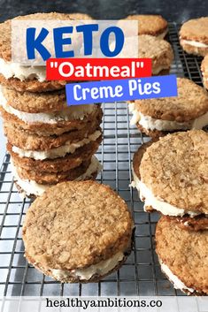 some cookies are stacked on top of each other with a sign that says keto oatmeal creme pies