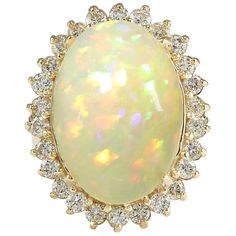 Stamped: 14K Yellow Gold Total Ring Weight: 9.2 Grams Total Natural Opal Weight is 11.28 Carat (Measures: 18.00x13.00 mm) Color: Multicolor Total Natural Diamond Weight is 1.23 Carat Color: F-G, Clarity: VS2-SI1 Face Measures: 25.30x20.45 mm Sku: [703089W] Opal Statement Ring, Opal Jewellery, Sapphire Cocktail Ring, Opal Diamond Ring, Yellow Gold Diamond Ring, Diamond Cocktail Rings, Rings Gold, Gold Diamond Ring, 14k Gold Ring