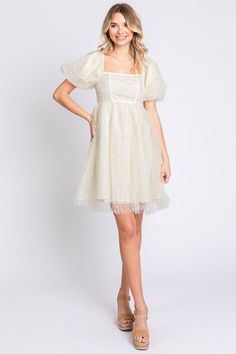 With a playful babydoll silhouette and delicate pearl embellishments, this dress is designed with the dreamiest details! The sheer mesh overlay adds a whimsical charm, while the puff sleeves and square neckline give it a modern, romantic vibe. Get ready for the compliments! Designer pearl mesh faux pearl embellished Puff sleeve, short sleeve Back zipper closure Lined Mini hem length Non stretch Square neck Hand wash cold, Line dry Babydoll, fit and flare Self: 100% Poly Contrast: 50% Poly/ 50% N Core Outfits, Nostalgia Core, Babydoll Mini Dress, Flowy Design, Royal Dresses, Plus Dresses, Cream Dress, Floral Dress Black, Babydoll Dress