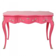 a pink desk with two drawers and gold trimmings on the top, against a white background