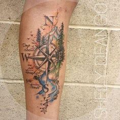 a person with a compass tattoo on their leg