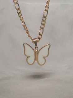 Entire necklace is 18k Gold Filled 18-inch chain White butterflies are a very positive omen of good luck, purity, rebirth, and great transformation. If a white butterfly finds you, consider it a really good sign <3 Butterfly Chain Necklaces, Butterfly Shaped Necklace With Chain As Gift, White Butterfly Necklace With Delicate Chain, Gold Butterfly Chain Jewelry, Rose Gold Butterfly Pendant Necklace, White Butterfly Necklace As A Gift, White Charm Necklace With Delicate Chain For Gift, White Delicate Chain Charm Necklace As A Gift, White Butterfly Necklace For Gift