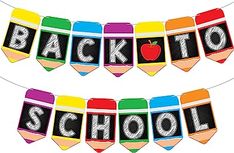 back to school banner with crayons and an apple on the top, hanging from a string